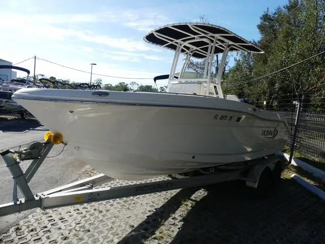 Slide: The Image of 2023 Robalo R200 boat on trailer, parked outdoors. - 3