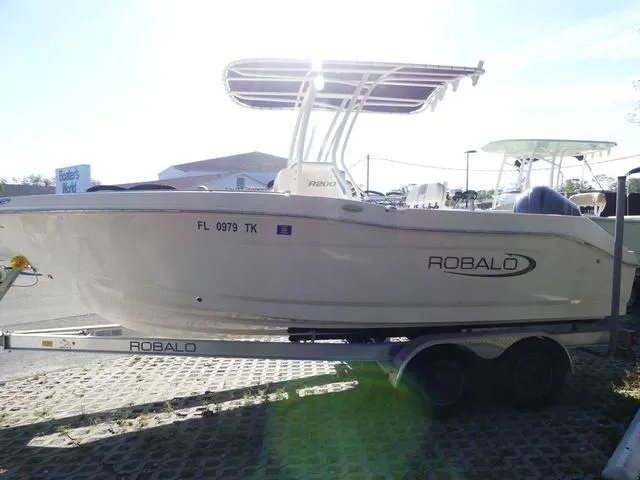 Slide: The Image of 2023 Robalo R200 boat on trailer, side view, sunny day. - 4