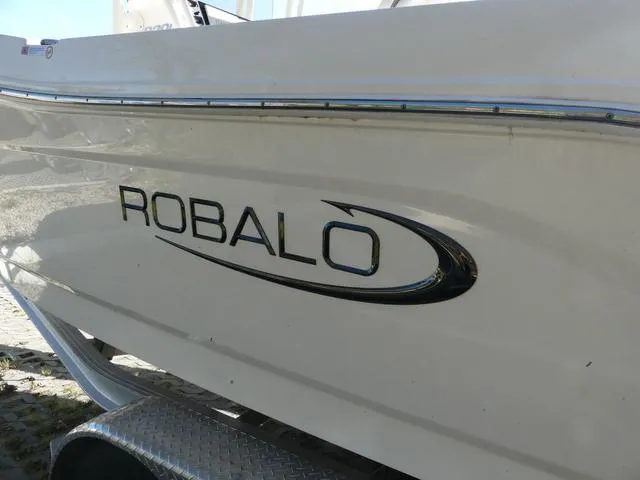 Slide: The Image of 2023 Robalo R200 boat side view with logo on trailer. - 5