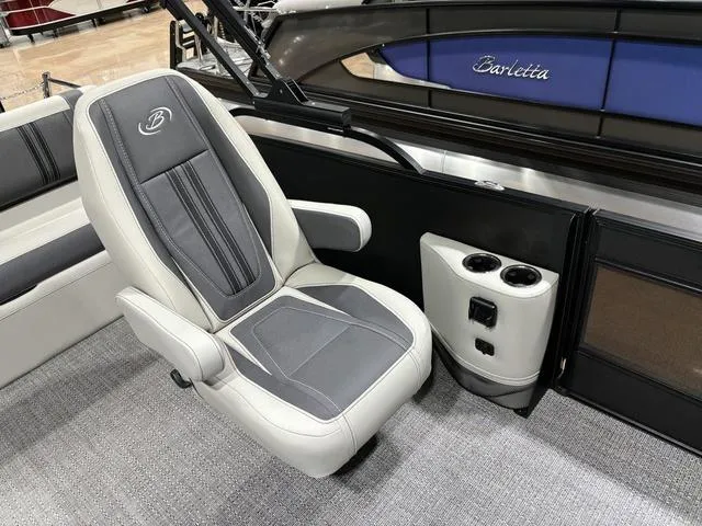 Slide: The Image of 2025 Barletta Corsa 23UC boat interior with gray seating and cup holders. - 15