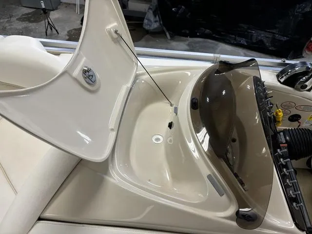 Slide: The Image of Open storage compartment on 2013 Harris ROYAL 250 boat dashboard. - 14