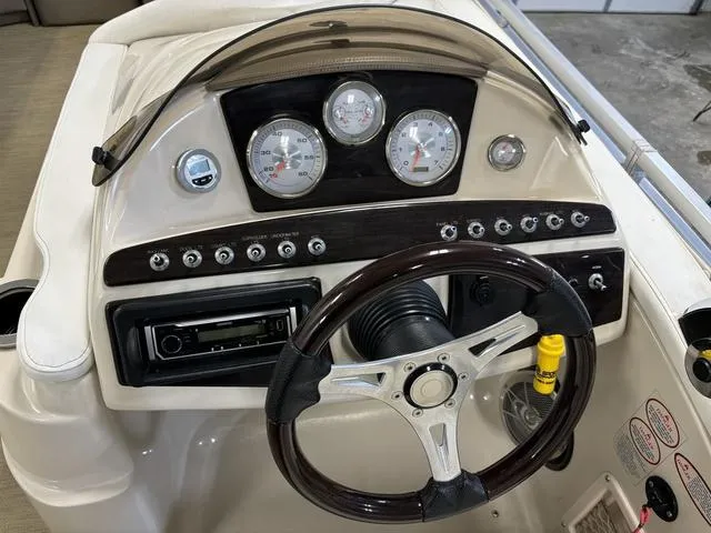 Slide: The Image of Harris ROYAL 250 boat dashboard with gauges and steering wheel, 2013 model. - 15