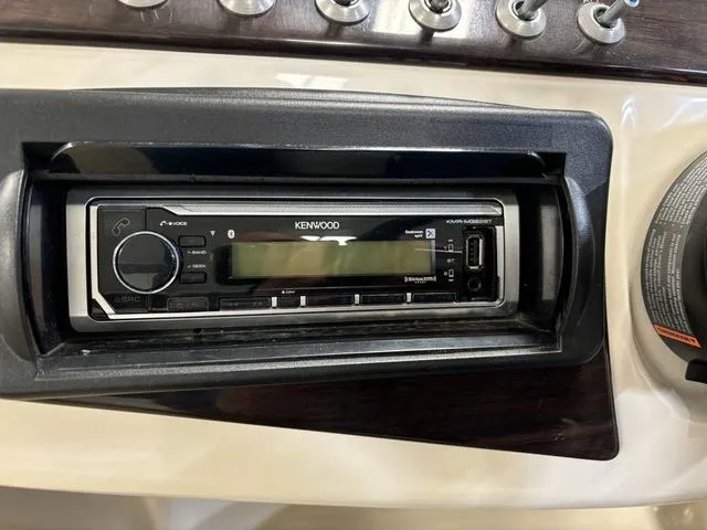 Slide: The Image of Kenwood stereo system in 2013 Harris ROYAL 250 boat dashboard. - 19