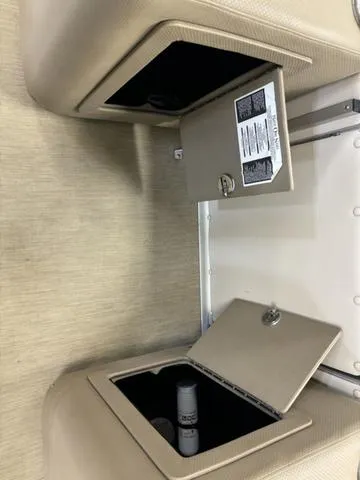 Slide: The Image of Open storage compartments in a 2013 Harris ROYAL 250 boat interior. - 21