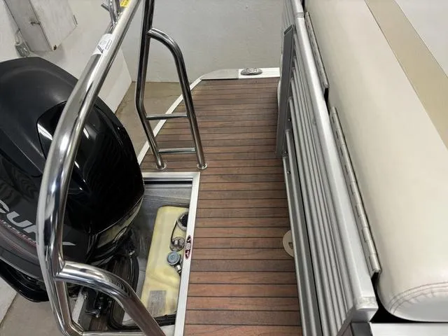 Slide: The Image of 2013 Harris ROYAL 250 boat with wooden deck and outboard motor. - 26