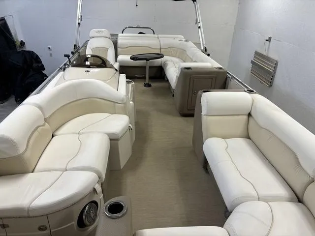 Slide: The Image of Luxurious 2013 Harris ROYAL 250 pontoon boat with spacious white seating and modern design. - 3