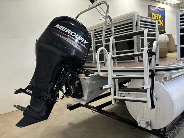 Slide: The Image of 2013 Harris ROYAL 250 pontoon boat with Mercury outboard motor in a showroom. - 31