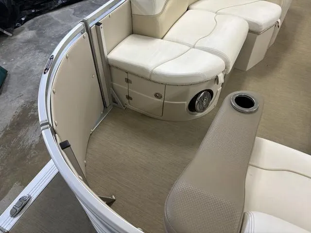Slide: The Image of Harris ROYAL 250 boat interior, 2013 model, featuring beige seating and cup holder. - 4
