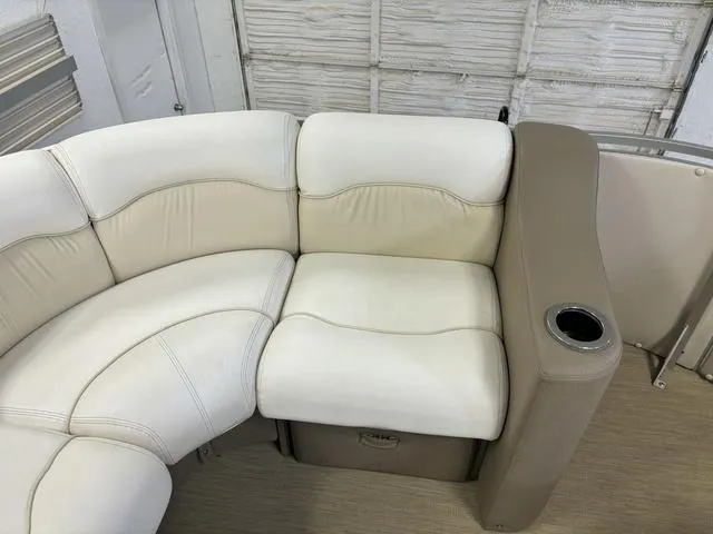 Slide: The Image of Harris ROYAL 250 2013 boat seating with beige and white upholstery, cup holder. - 7