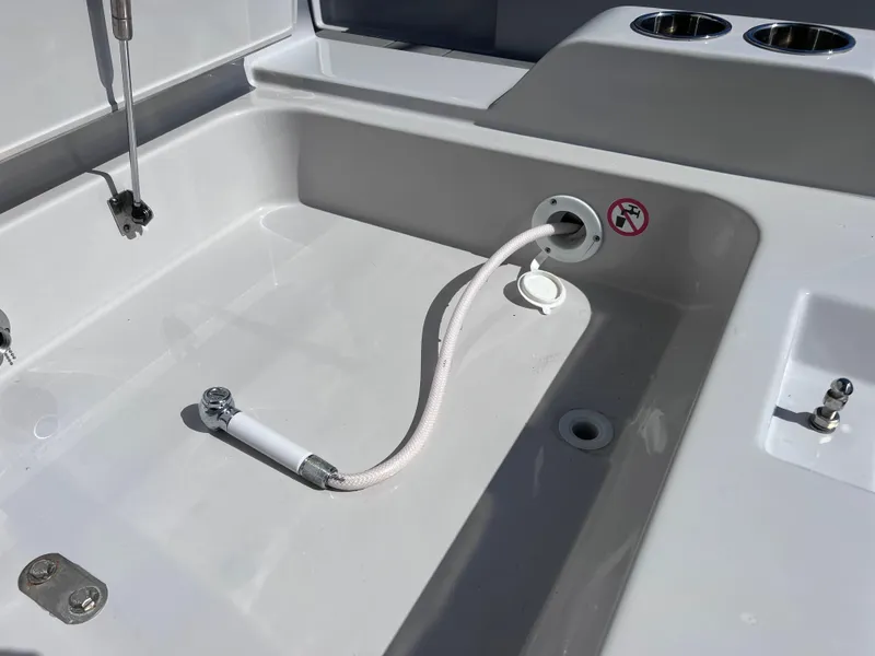 Slide: The Image of Aviara AV 32 Outboard 2022 boat deck with hose and cup holders. - 27