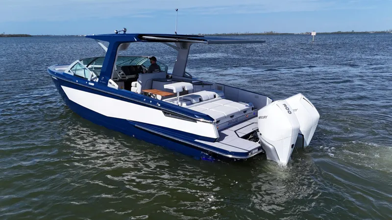 Slide: The Image of 2022 Aviara AV 32 Outboard boat cruising on open water. - 3