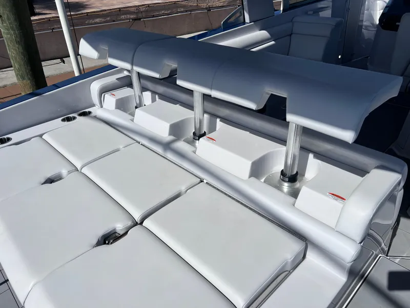 Slide: The Image of 2022 Aviara AV 32 Outboard boat with sleek white seating and modern design. - 31