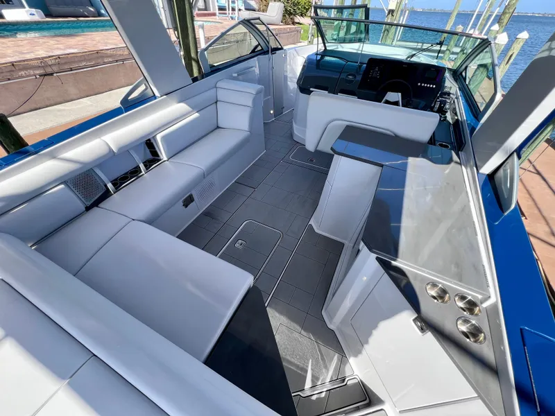Slide: The Image of 2022 Aviara AV 32 Outboard boat interior with sleek seating and modern dashboard. - 33