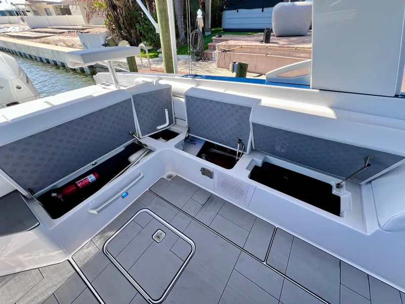 Slide: The Image of 2022 Aviara AV 32 Outboard boat with open storage compartments and sleek deck design. - 38