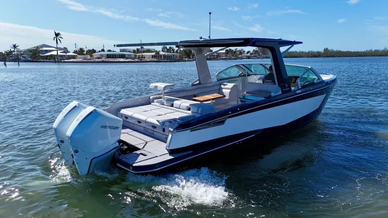 Slide: The Image of 2022 Aviara AV 32 Outboard boat cruising on a sunny day. - 5