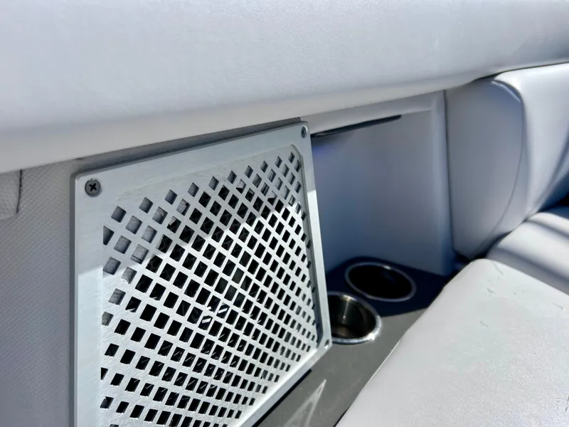 Slide: The Image of Aviara AV 32 Outboard 2022 interior detail with vent and cup holder. - 51