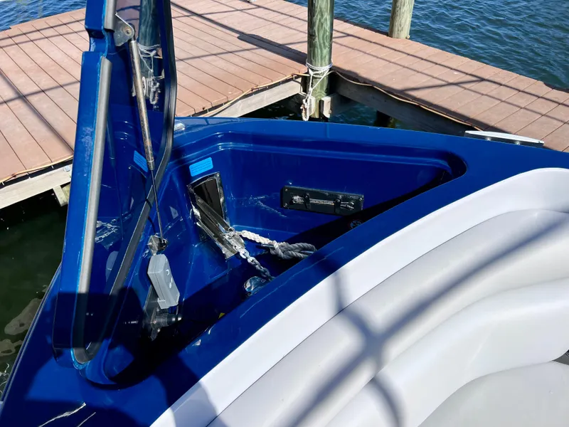 Slide: The Image of 2022 Aviara AV 32 Outboard boat with open storage compartment by the dock. - 52