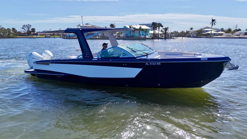 Slide: The Image of 2022 Aviara AV 32 Outboard boat cruising on a sunny day. - 6