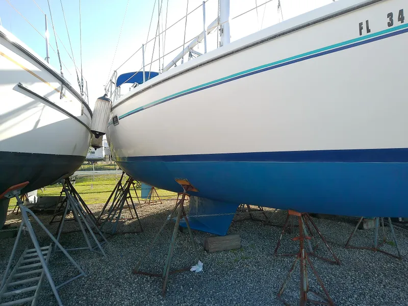 Slide: The Image of 1995 Catalina 36 MkII sailboat on stands, hull view, outdoors. - 1