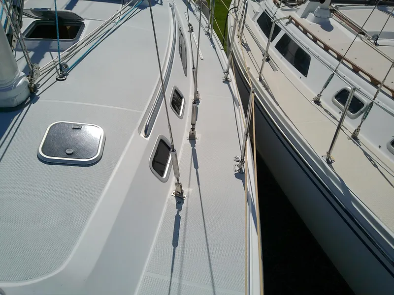 Slide: The Image of 1995 Catalina 36 MkII sailboat deck view with rigging and hatches. - 16