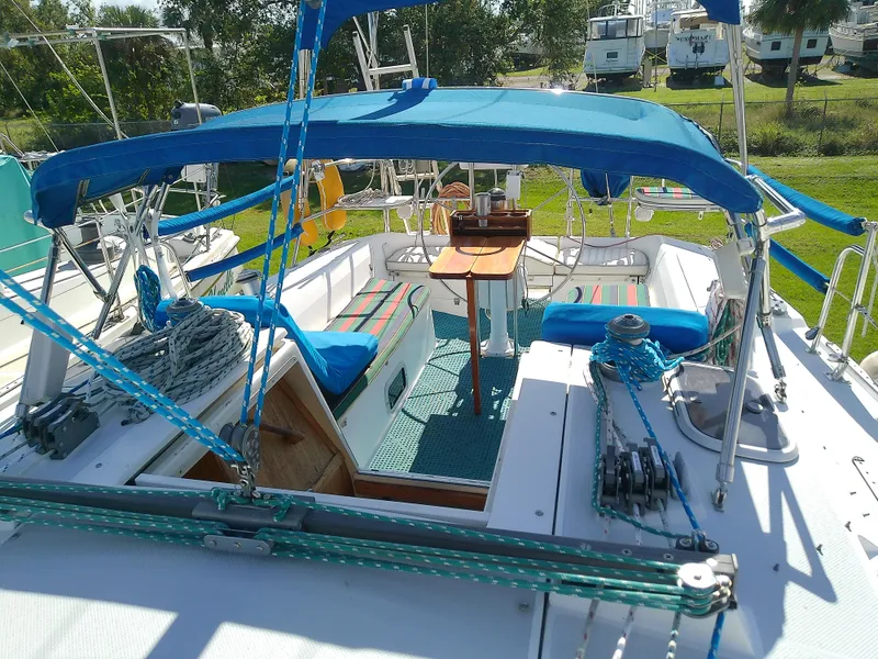 Slide: The Image of 1995 Catalina 36 MkII sailboat cockpit with blue canopy and seating. - 17