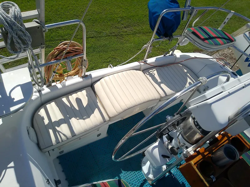 Slide: The Image of Cockpit of 1995 Catalina 36 MkII sailboat with cushioned seating and steering wheel. - 22