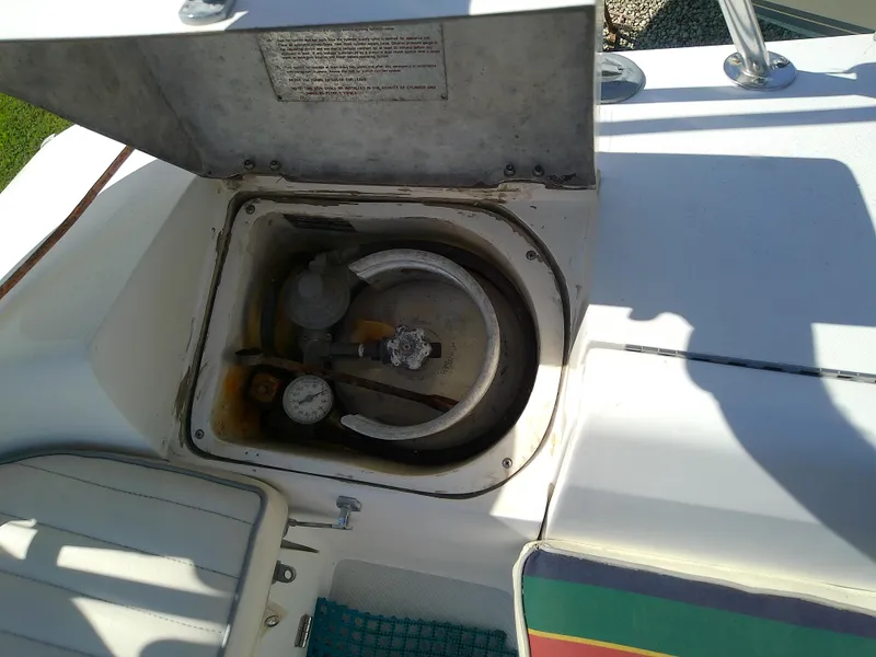 Slide: The Image of Open compartment on 1995 Catalina 36 MkII sailboat deck showing equipment. - 27