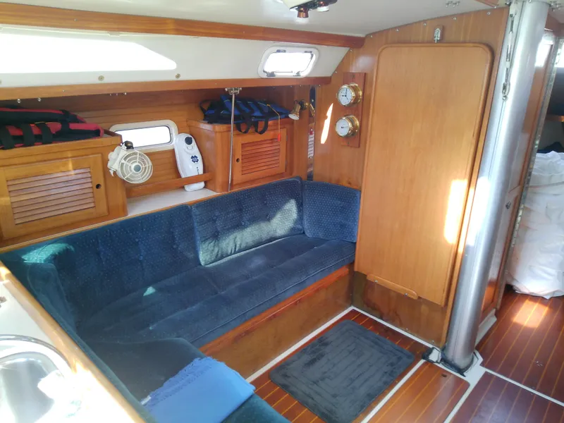 Slide: The Image of Interior of 1995 Catalina 36 MkII sailboat with blue seating and wooden finishes. - 30