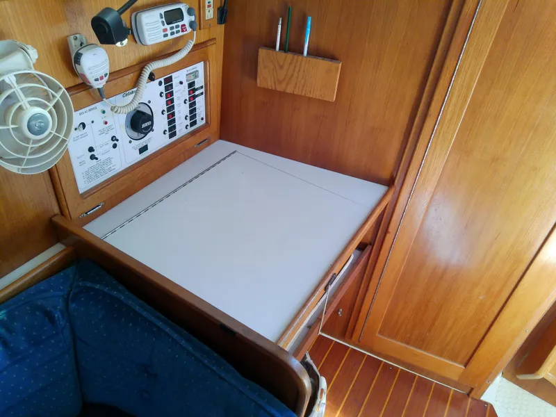Slide: The Image of Navigation station in 1995 Catalina 36 MkII sailboat with control panel and fan. - 33