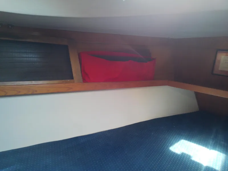 Slide: The Image of Interior cabin of 1995 Catalina 36 MkII sailboat with wooden trim and red storage bag. - 40