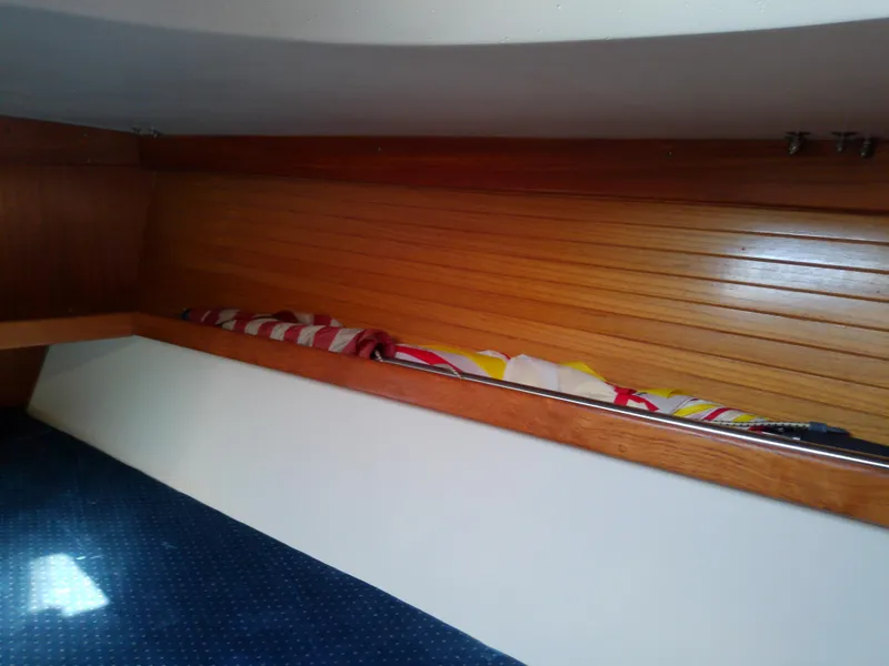Slide: The Image of Interior of 1995 Catalina 36 MkII sailboat with wooden paneling and colorful fabric. - 41