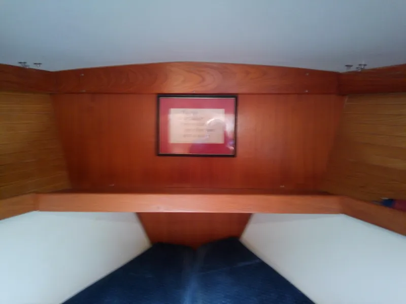 Slide: The Image of Interior of 1995 Catalina 36 MkII sailboat with wooden paneling and framed picture. - 42