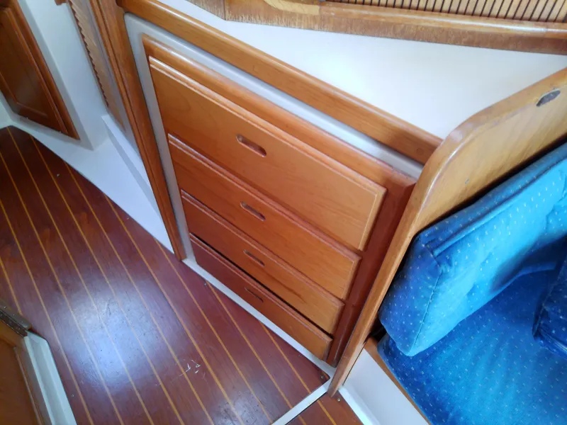 Slide: The Image of Wooden interior drawers and seating in a 1995 Catalina 36 MkII sailboat. - 43