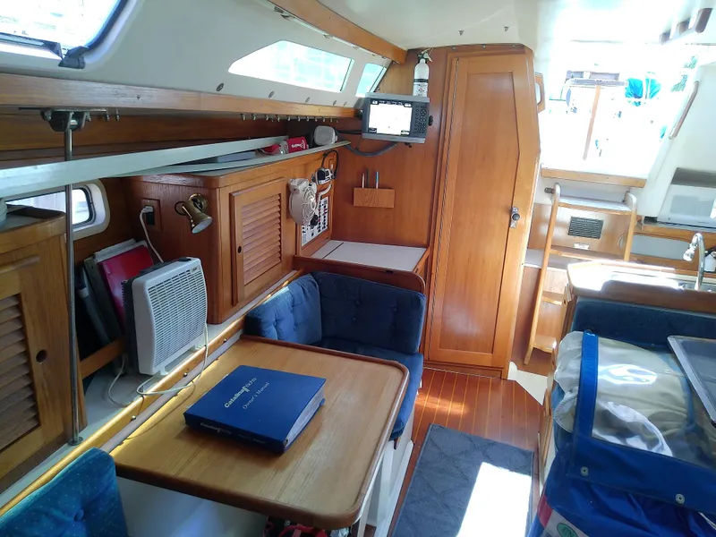 Slide: The Image of Interior of 1995 Catalina 36 MkII sailboat with wood finish and seating area. - 46