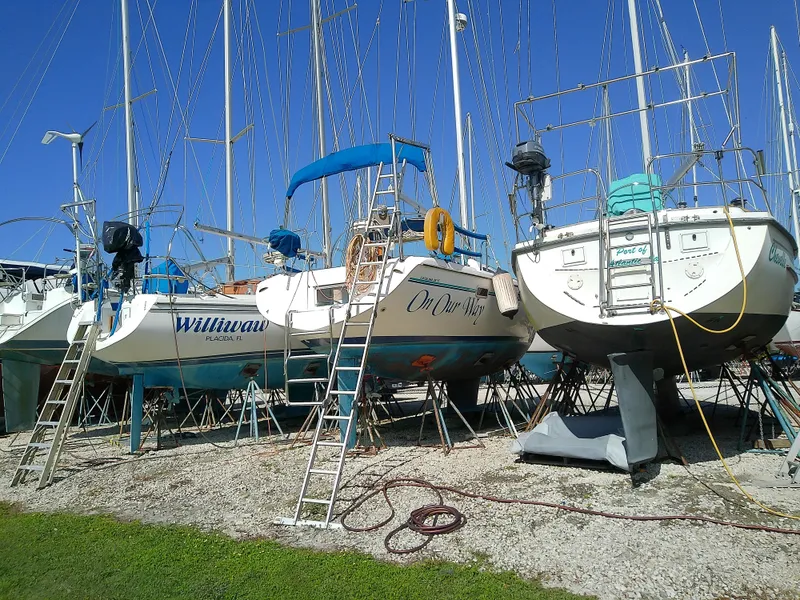 Slide: The Image of Catalina 36 MkII sailboats in dry dock, 1995 models, with ladders and clear blue sky. - 5
