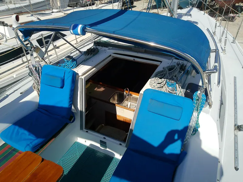 Slide: The Image of 1995 Catalina 36 MkII sailboat cockpit with blue canopy and seating. - 9