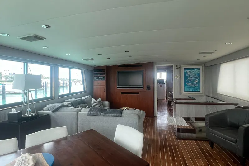 Slide: The Image of Luxurious interior of 1990 Hatteras 70 Cockpit Motor Yacht with modern furnishings. - 14