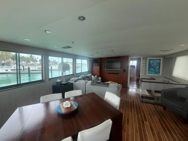 Slide: The Image of Luxurious interior of 1990 Hatteras 70 Cockpit Motor Yacht with elegant furnishings. - 15