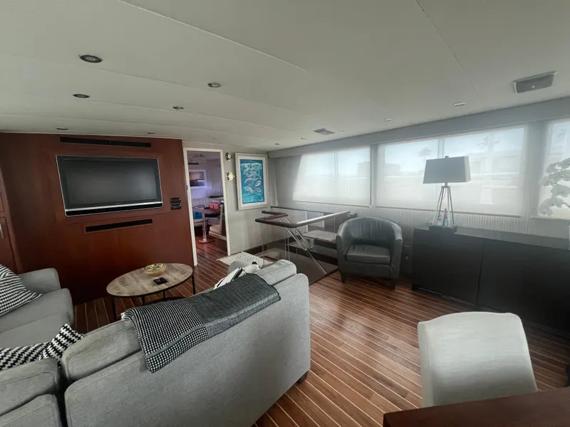 Slide: The Image of Luxurious interior of 1990 Hatteras 70 Cockpit Motor Yacht with modern furnishings. - 16