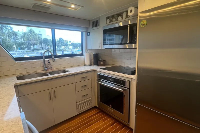 Slide: The Image of Modern kitchen in 1990 Hatteras 70 Cockpit Motor Yacht with stainless steel appliances. - 21