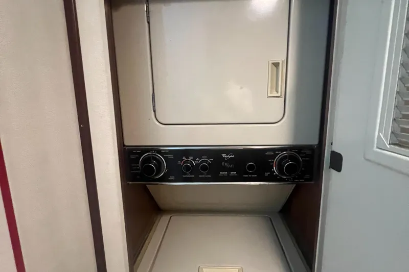 Slide: The Image of Laundry unit inside 1990 Hatteras 70 Cockpit Motor Yacht. - 46