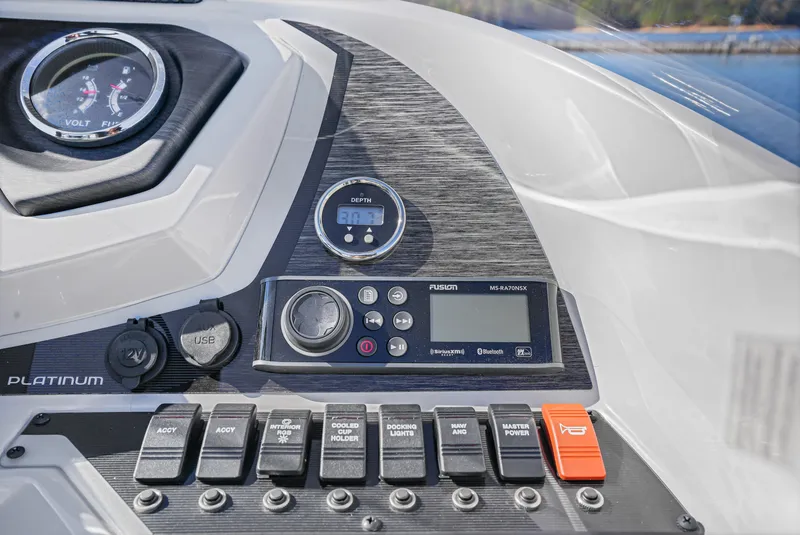 Slide: The Image of Control panel of 2021 Crest Classic DLX 220 SLRC boat with gauges and switches. - 24