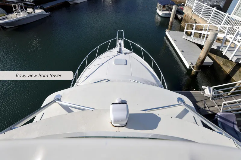 Slide: The Image of Bow view from tower of 2000 Cabo 35 Express boat in marina. - 14