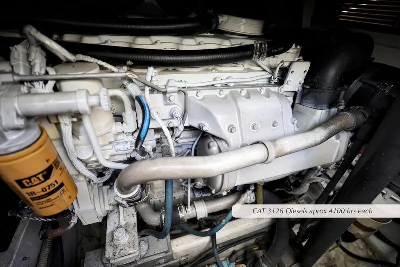 Slide: The Image of Engine of a 2000 Cabo 35 Express boat, featuring CAT 3126 diesel with 400 hours. - 28