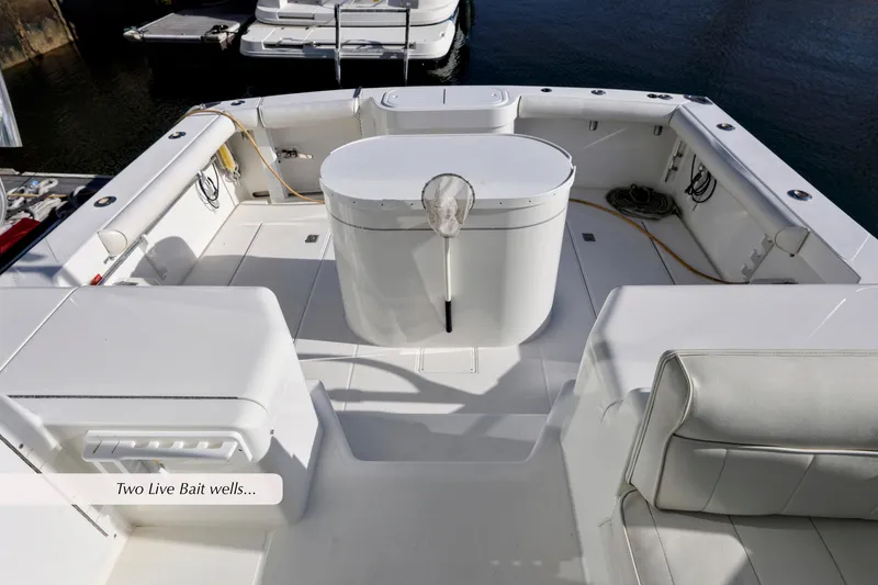 Slide: The Image of 2000 Cabo 35 Express boat deck with two live bait wells. - 6