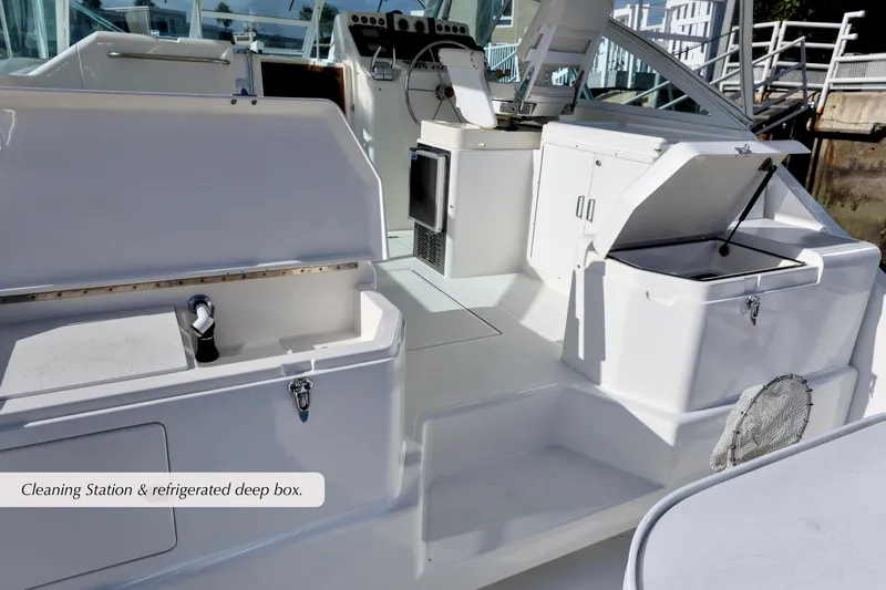 Slide: The Image of 2000 Cabo 35 Express boat with cleaning station and refrigerated deep box. - 7