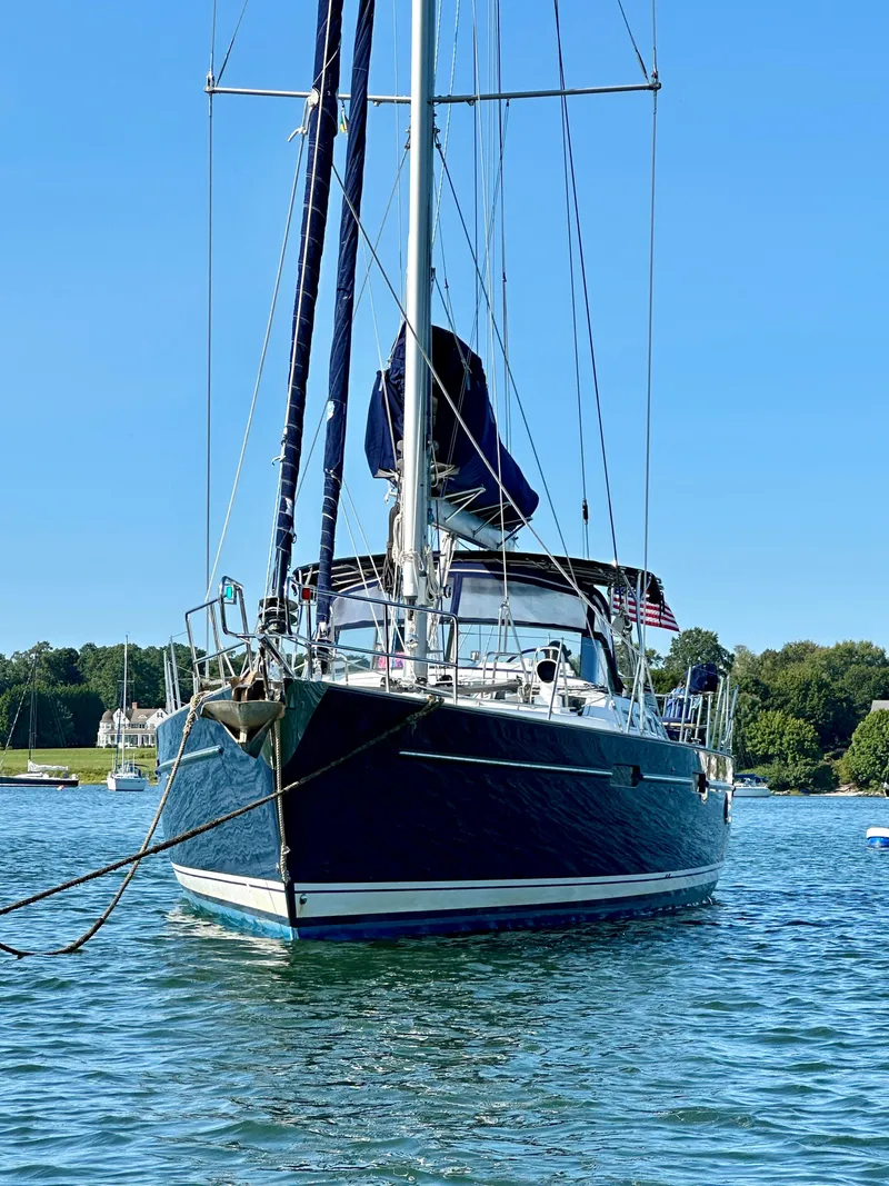 Slide: The Image of Sailing yacht Beneteau 57, 2010 model, anchored on a sunny day with clear blue skies. - 4
