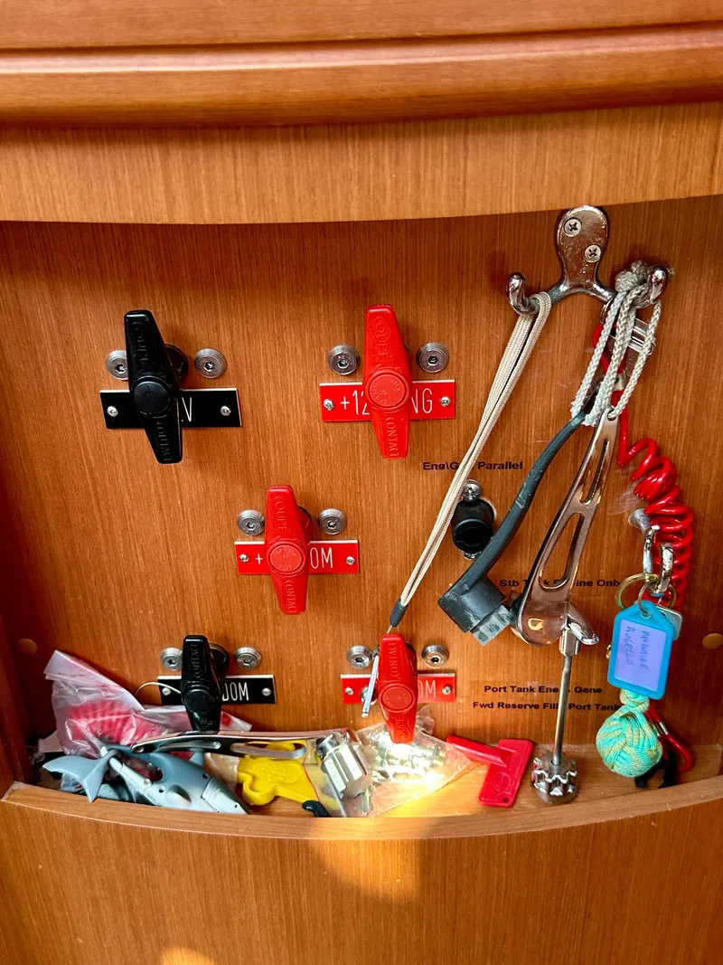 Slide: The Image of Control panel with switches and tools on a 2010 Beneteau 57 yacht. - 42