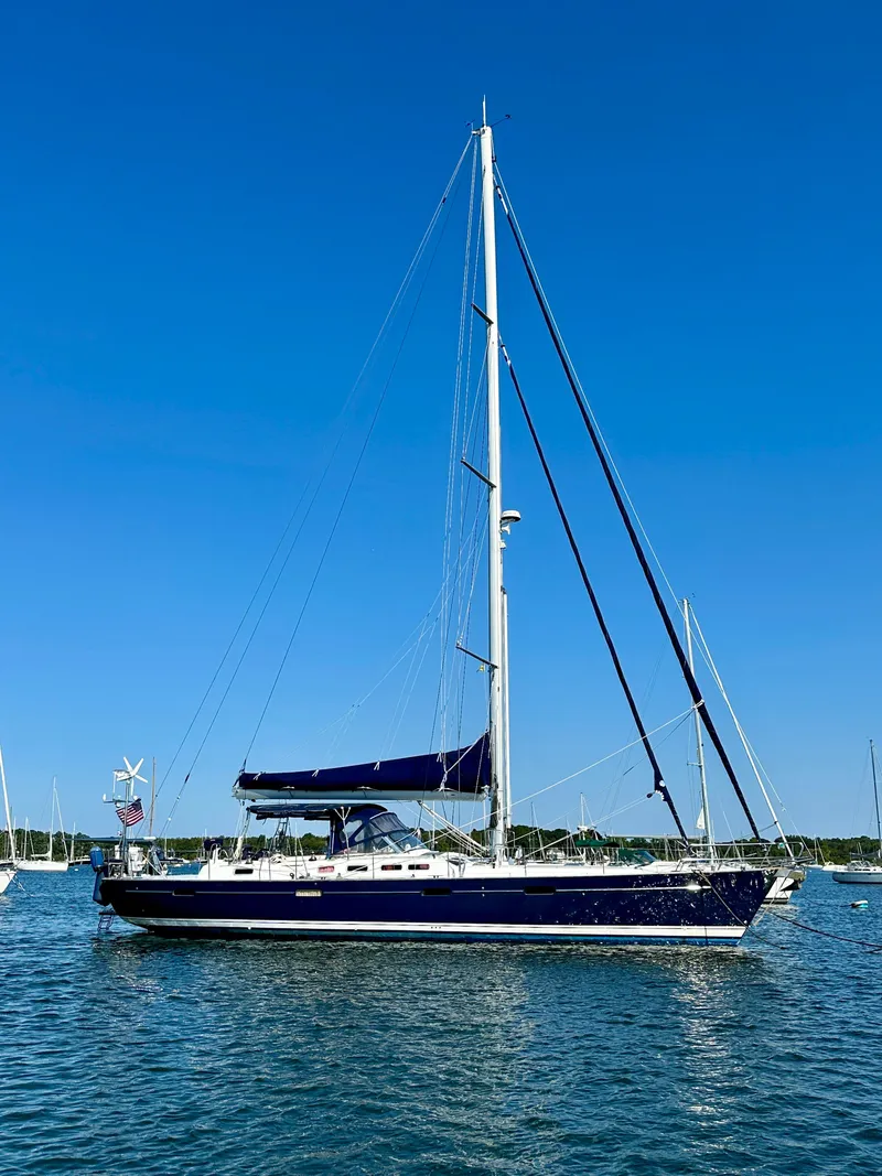 Slide: The Image of Sailing yacht Beneteau 57, 2010 model, anchored on a sunny day with clear blue skies. - 6
