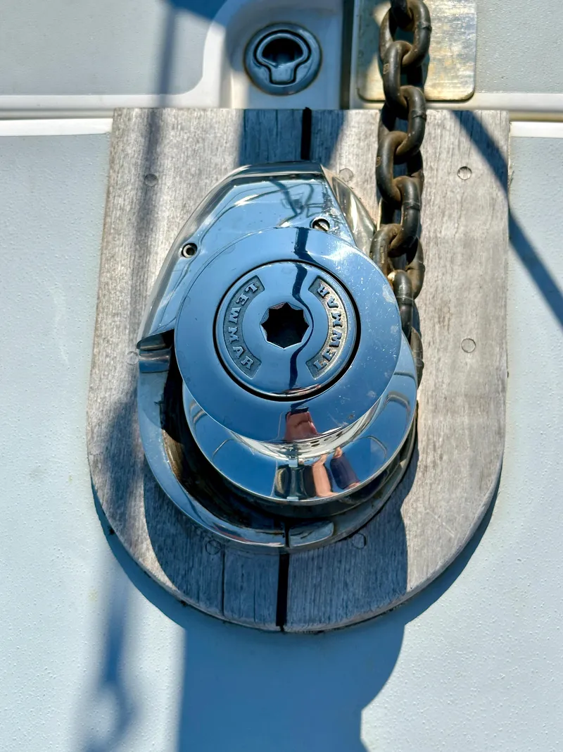Slide: The Image of Chrome winch on 2010 Beneteau 57 yacht deck with chain. - 8